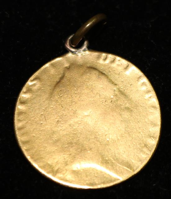 A later mounted Georgian gold guinea.